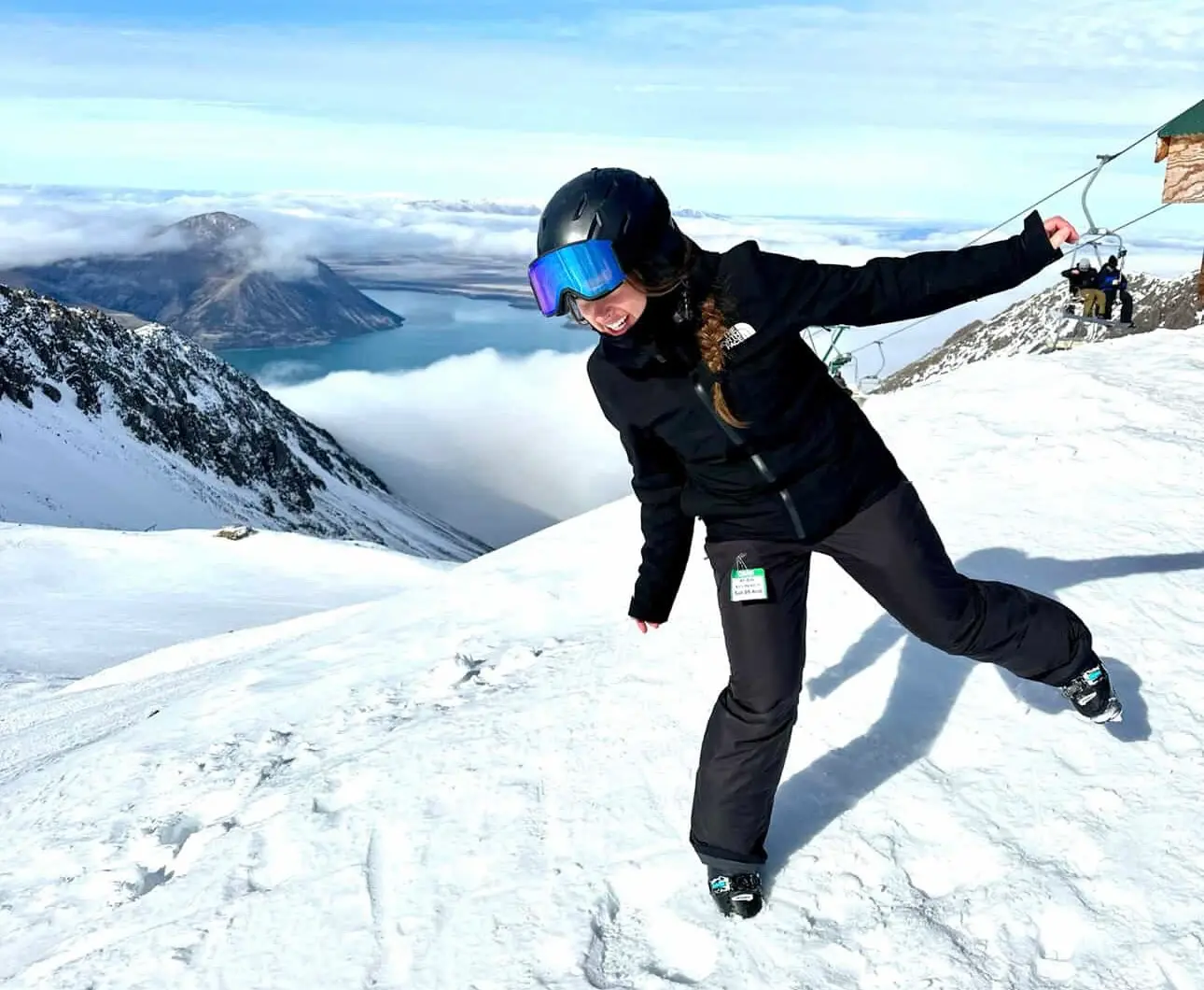 Olivia Lufman, adventure guide and marketing at Swiss Local Adventures, skiing in the mountains
