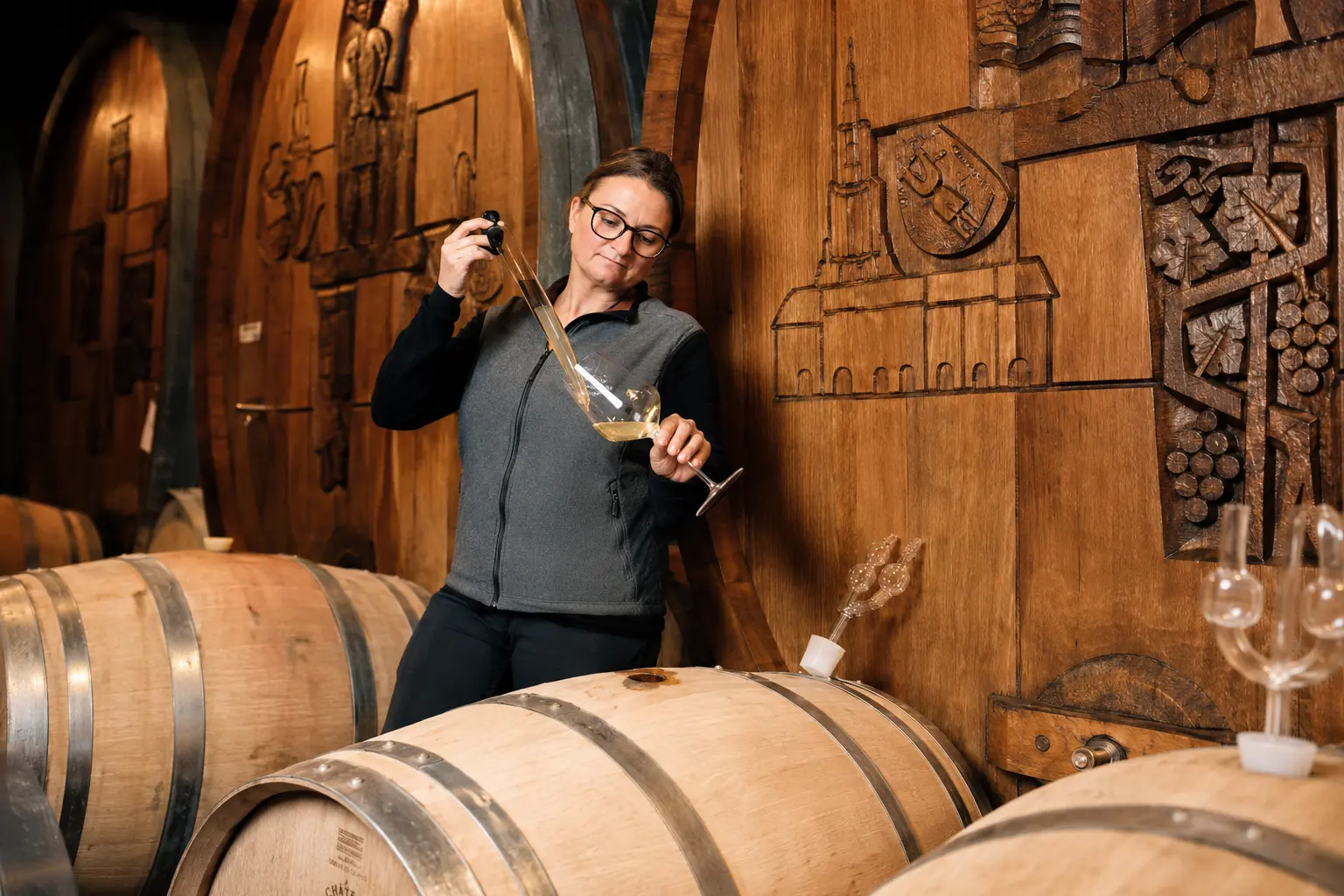 Wine tasting from barrel at Alpine Weinkultur cellar in Spiez, wine tour from Interlaken