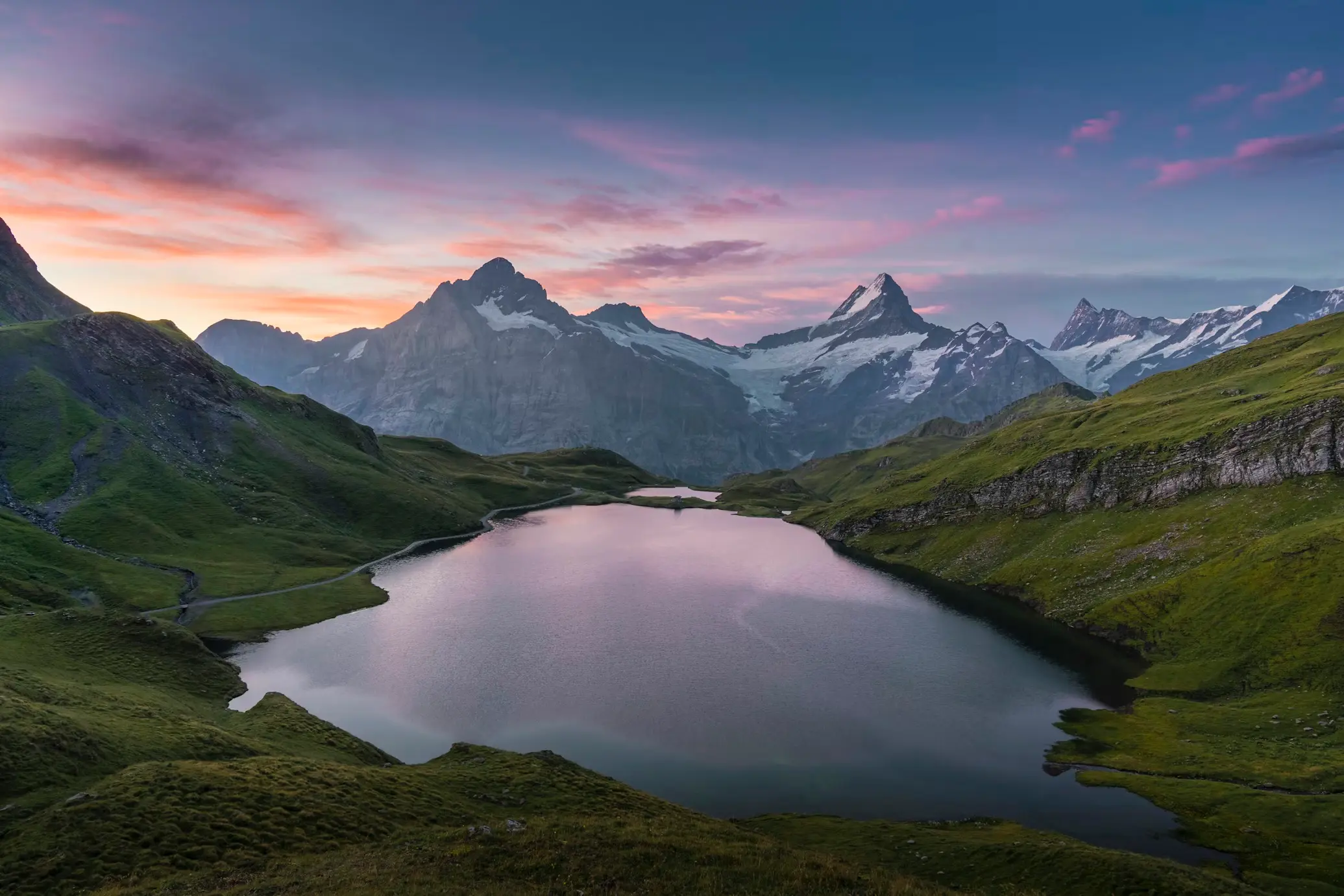 Bachalpsee alpine lake at sunrise above Grindelwald with Schreckhorn reflection, Bernese Oberland Switzerland