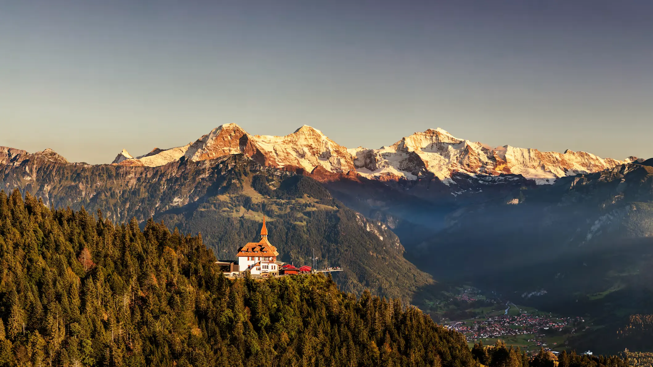 Harder Kulm viewpoint above Interlaken with Eiger Mönch and Jungfrau panorama, summer evening Bernese Oberland Switzerland