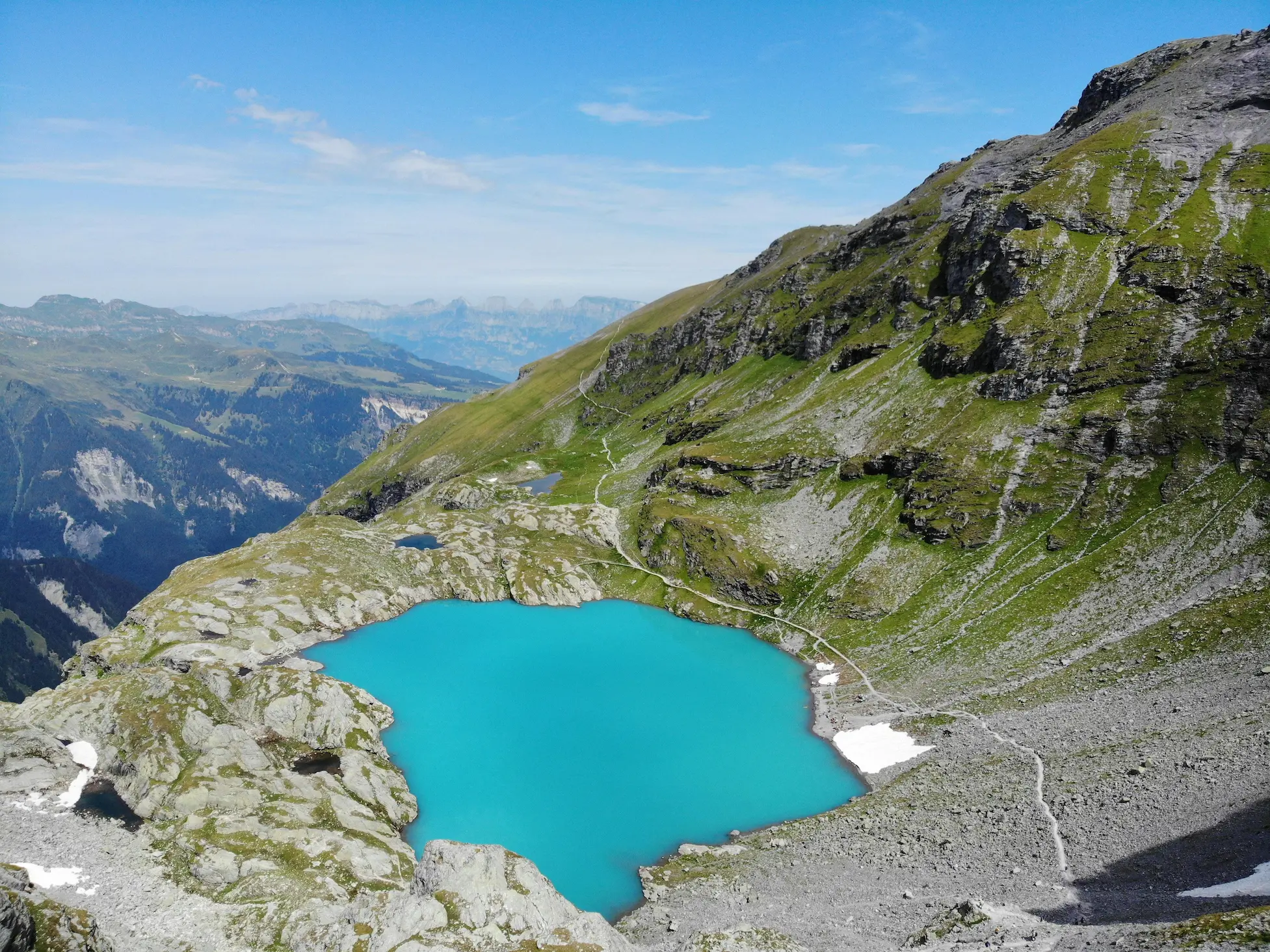 Hidden turquoise alpine lake in rocky high-altitude terrain above Interlaken, Bernese Oberland Switzerland