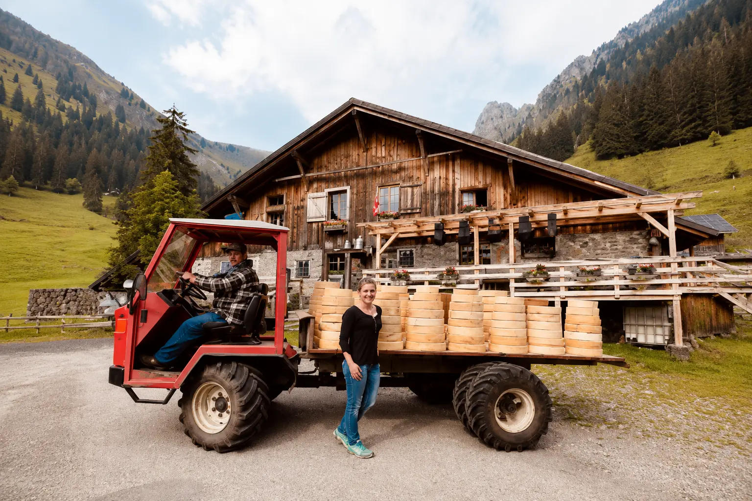 Farmers loading a summer of alpine cheese wheels onto a truck outside a Justistal alp hut before the Chästeilet